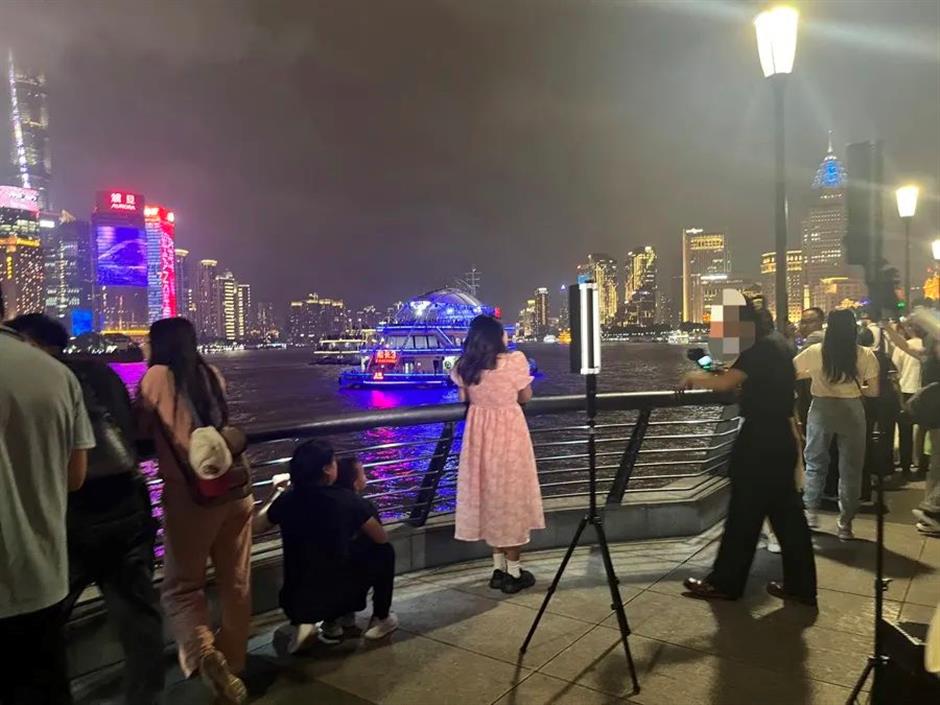 unlicensed photographers hogging prime spots on shanghai's iconic bund