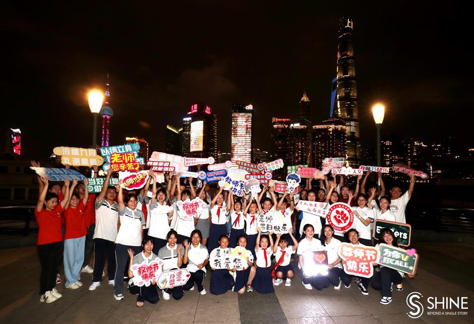 bund buildings illuminated to mark teachers' day