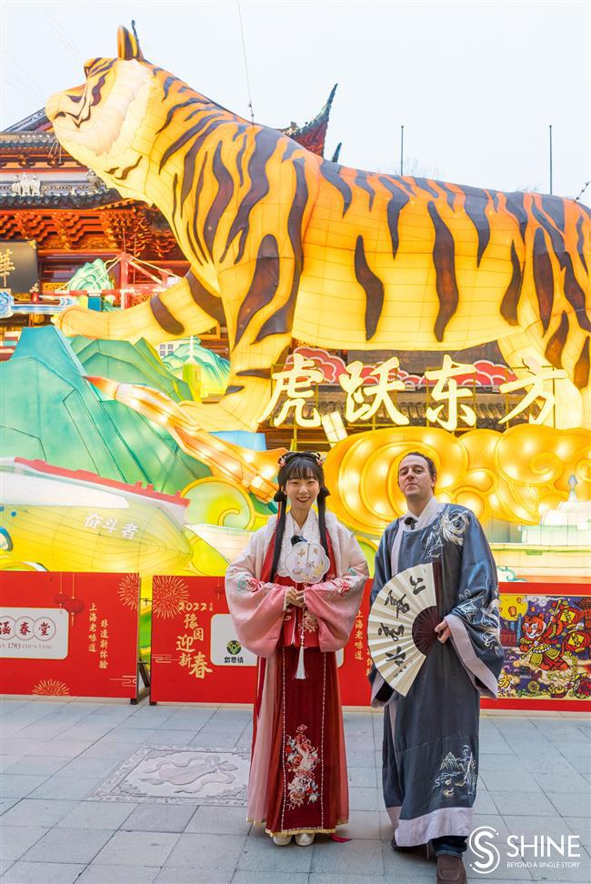 in <i>hanfu</i> costume, soaking up culture in the city's traditional lantern fair