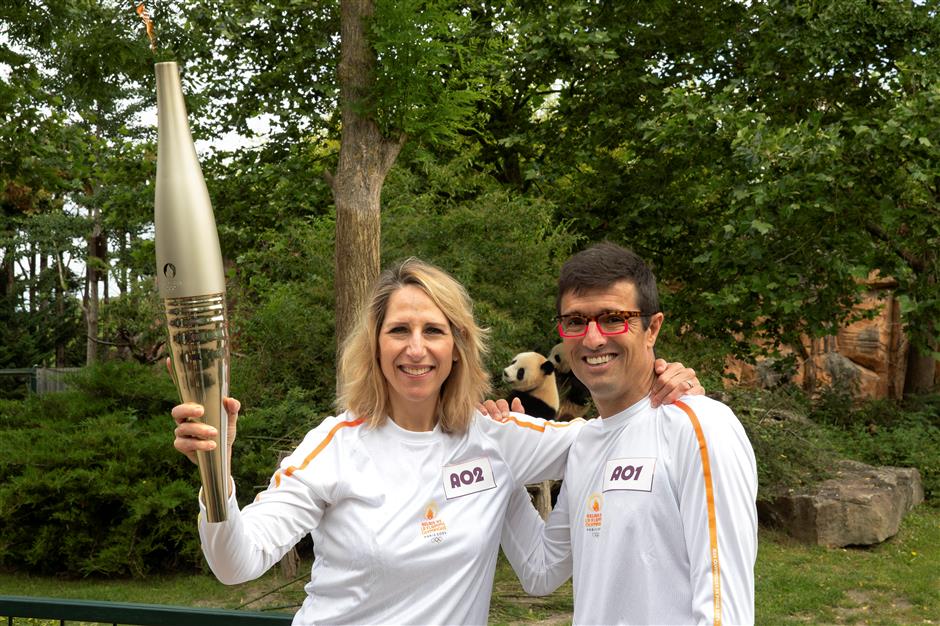 china's giant pandas witness paris olympic torch relay