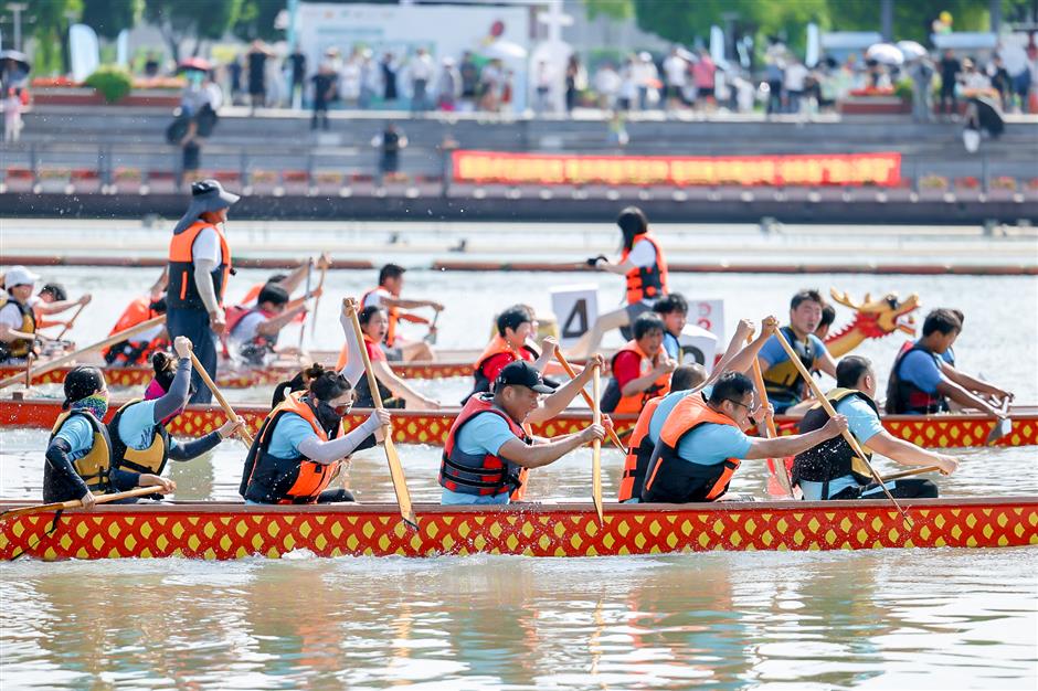 dragon boat teams compete on suburban river