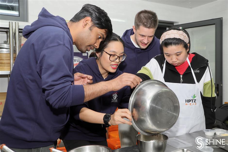 global volunteers come together to bake and learn with special needs students in shanghai