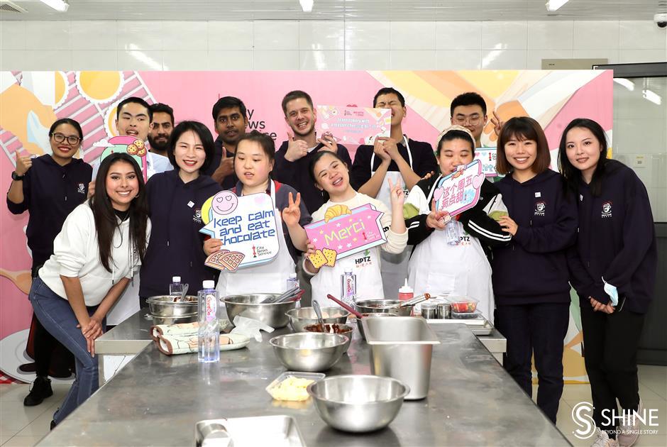 global volunteers come together to bake and learn with special needs students in shanghai