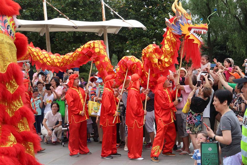 locals enjoy folk activities marking dragon boat festival