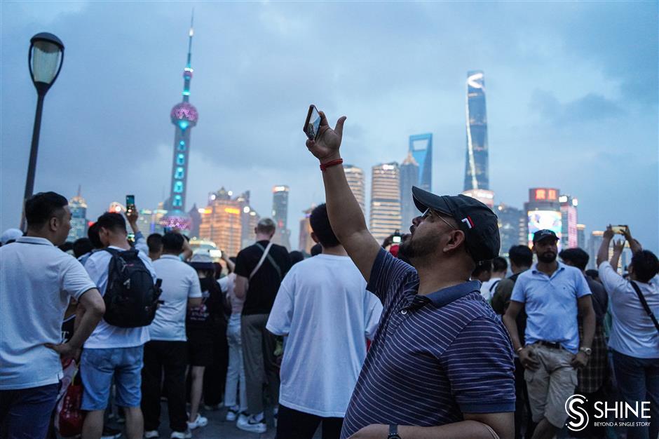 beautiful bund! shanghai dazzles as the night lights come on