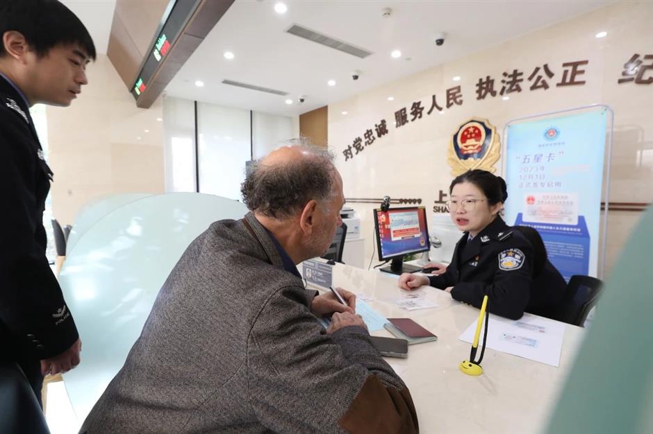 shanghai expats receive new 'five-star' permanent residence id cards