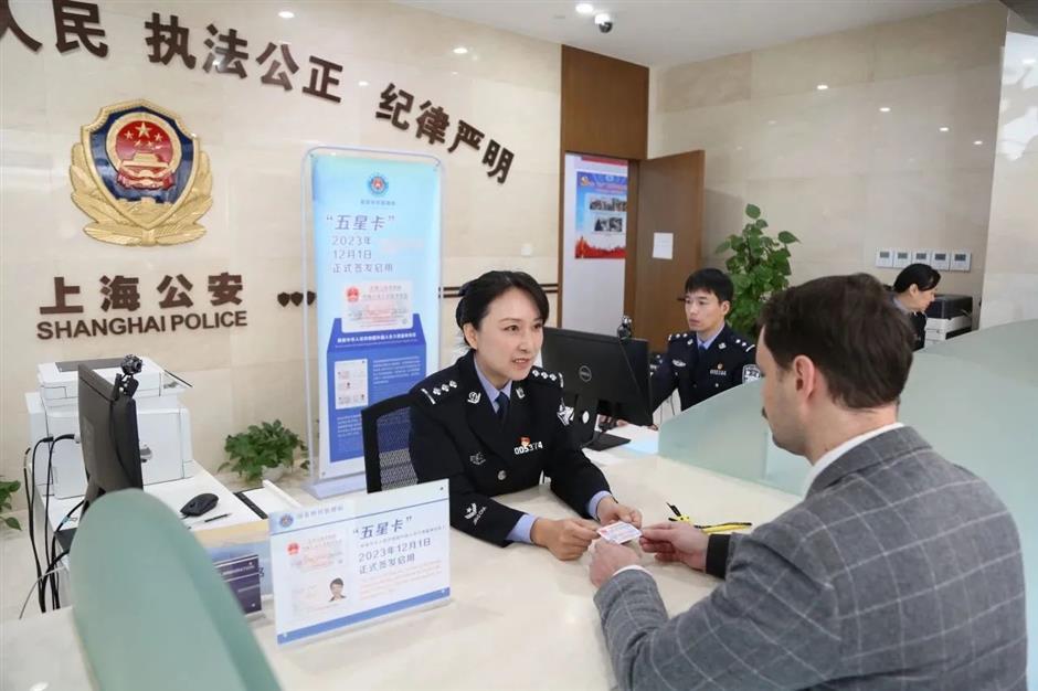 shanghai expats receive new 'five-star' permanent residence id cards