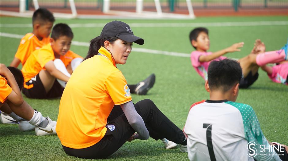 the former football pro passing her skills to shanghai's youth