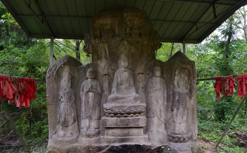 public sees red as buddhist cliff carvings painted in bright colors