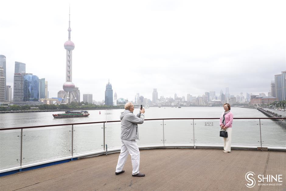 luxury cruise liner docks on north  bund, with 300 international tourists